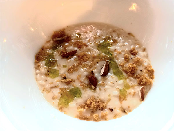 Risotto al latte di mandorla, bottarga di branzino e limone verde